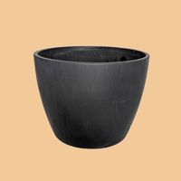 Black planter pot on a plain background.