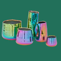 Set of five iridescent ceramic planters for compact houseplants  on a green background.