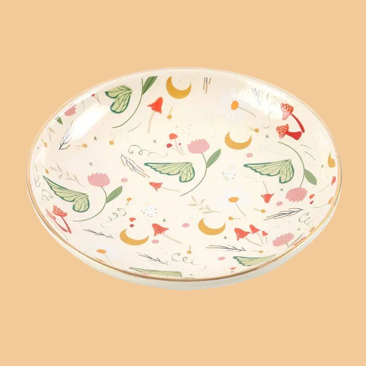 Decorative ceramic plate with floral and leaf patterns on a white background