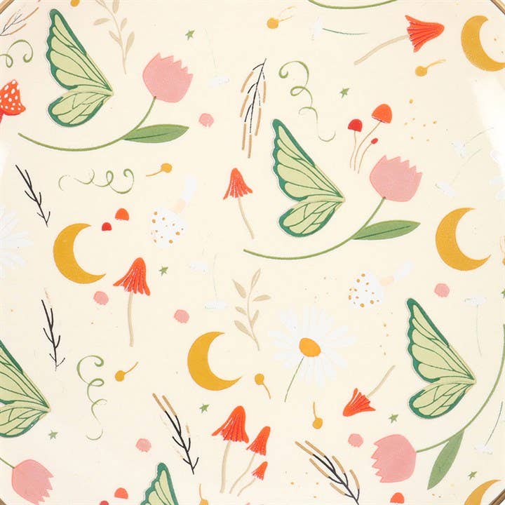 Pattern of green butterfly wings, pink flowers, and yellow crescent moons on a beige background. Ceramic plate print.